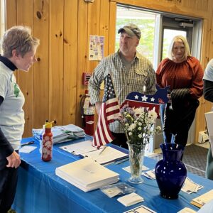 Sara welcomes Sheriff Trundy and Lorraine Trundy to the spring potluck