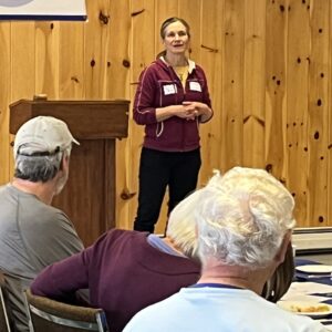 Elise Brown speaks to the group about why she's running for County Commissioner